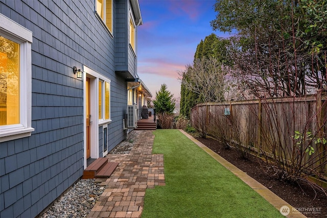 view of yard at dusk