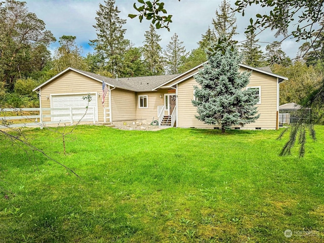 view of front of home with a garage and a front yard