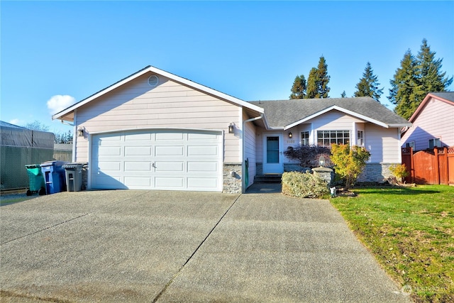 single story home with a garage and a front yard