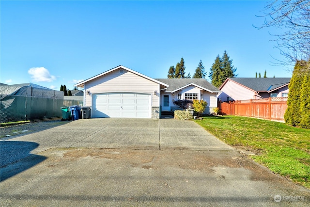 single story home featuring a garage and a front yard