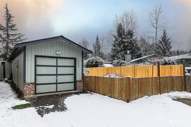 view of snow covered garage