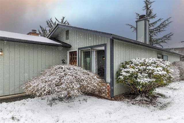 view of snow covered property