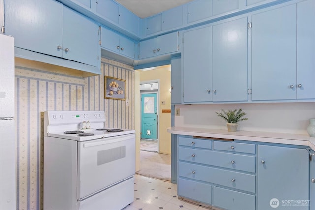 kitchen featuring blue cabinets and white range with electric cooktop