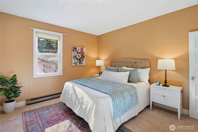 carpeted bedroom featuring a baseboard heating unit