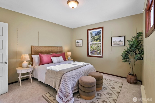 bedroom featuring light colored carpet