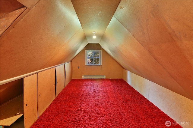 bonus room with lofted ceiling, a baseboard heating unit, and carpet flooring