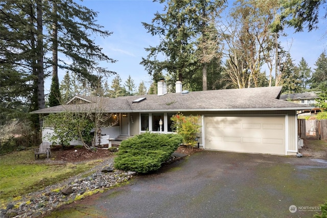 single story home featuring a garage