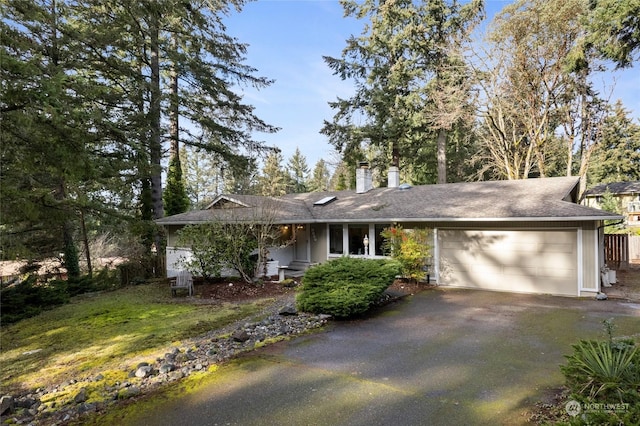 single story home featuring a garage