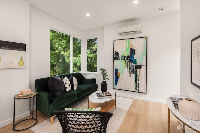 living room with wood-type flooring and a wall mounted AC