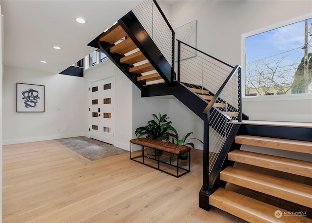 stairs with hardwood / wood-style floors