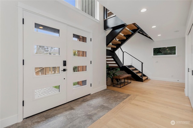 entrance foyer featuring french doors and light wood-type flooring