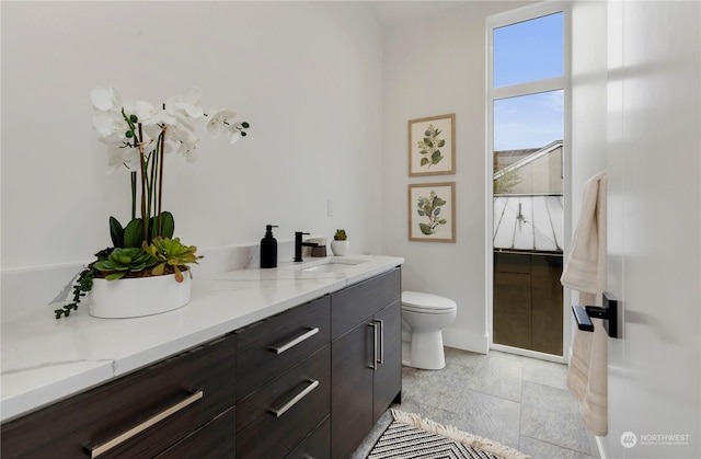 bathroom with vanity and toilet