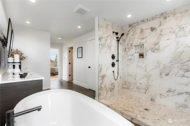 bathroom with separate shower and tub