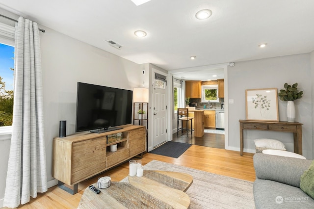 living room with light hardwood / wood-style flooring