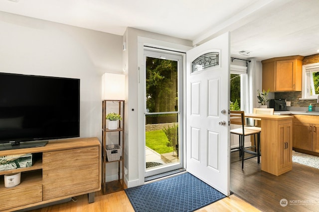 doorway to outside featuring hardwood / wood-style floors