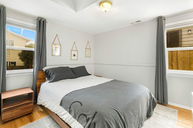 bedroom with light hardwood / wood-style floors