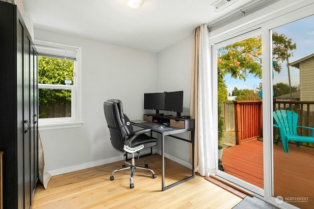 office space with light wood-type flooring