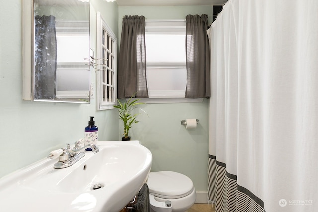 bathroom with toilet and sink