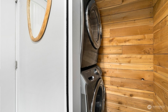 washroom featuring stacked washer and dryer