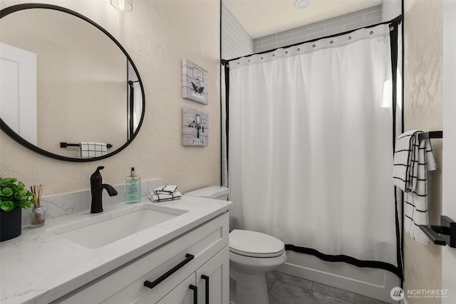 bathroom featuring toilet and vanity