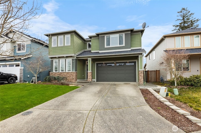 view of front of property featuring an attached garage, concrete driveway, and a front lawn