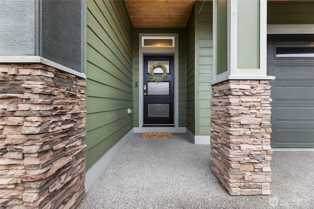 doorway to property with stone siding