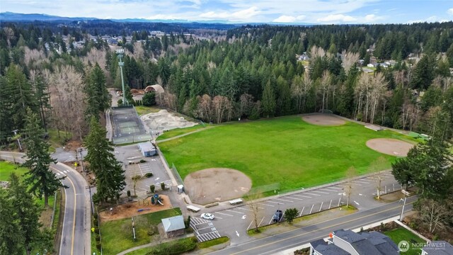 birds eye view of property with a wooded view