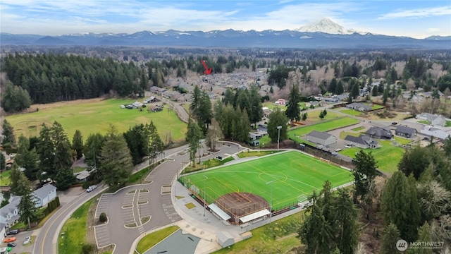 drone / aerial view featuring a mountain view