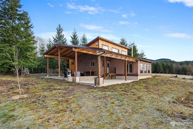 rear view of property with a patio