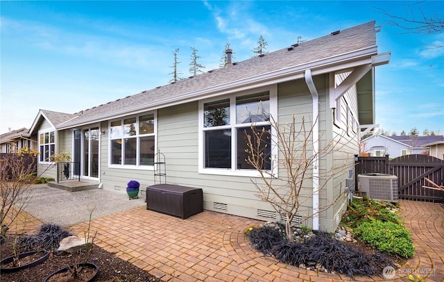 back of property featuring a gate, a patio, central AC, fence, and crawl space