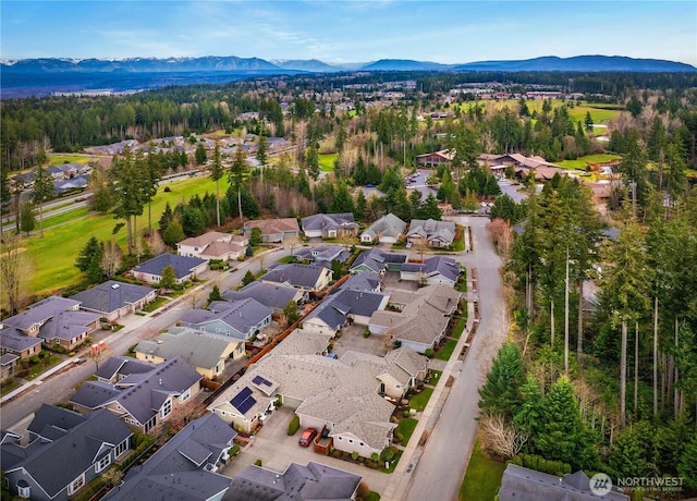 drone / aerial view with a mountain view and a residential view