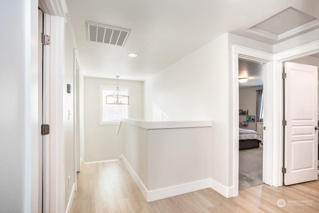 hallway with wood-type flooring