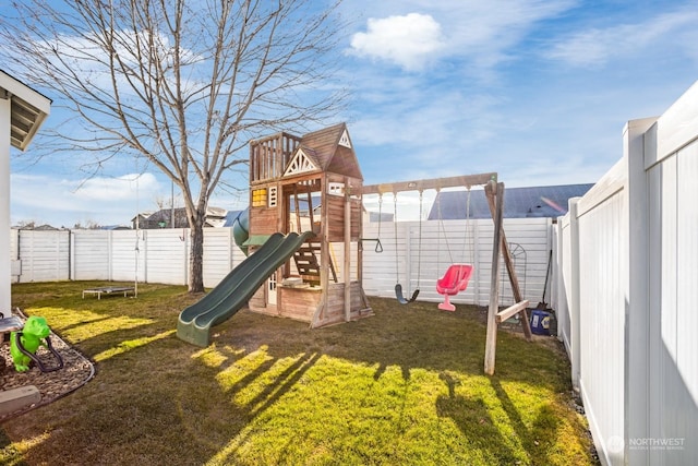 view of play area featuring a trampoline and a lawn