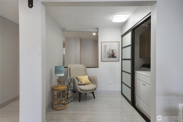 living area featuring washer / dryer