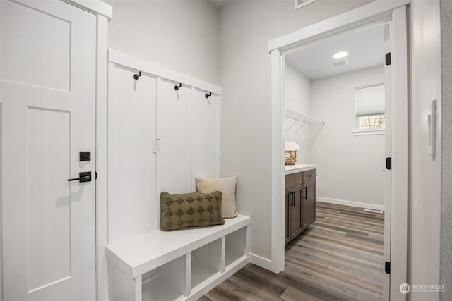 mudroom with hardwood / wood-style flooring