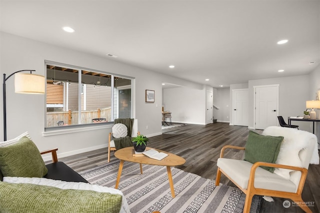 living room with dark hardwood / wood-style floors