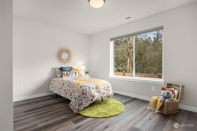 bedroom featuring dark hardwood / wood-style floors