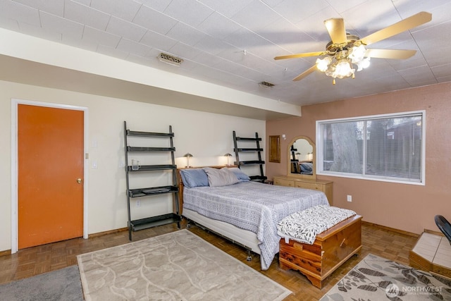 bedroom featuring parquet floors and ceiling fan