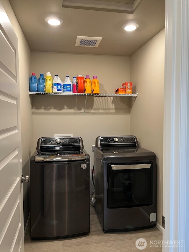 laundry room with washer and clothes dryer