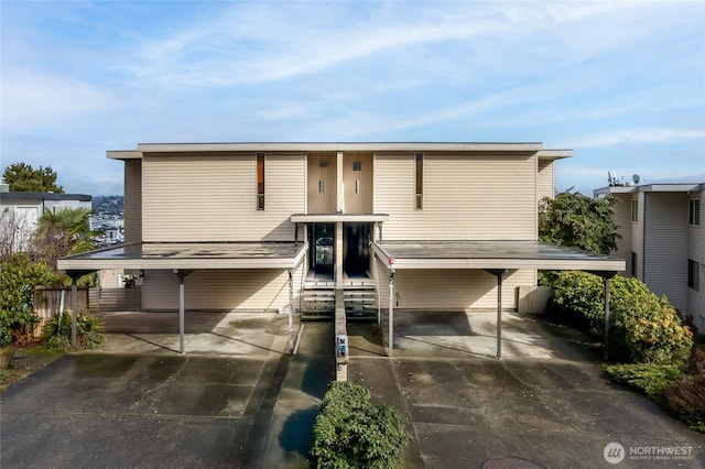 view of front of home featuring a carport