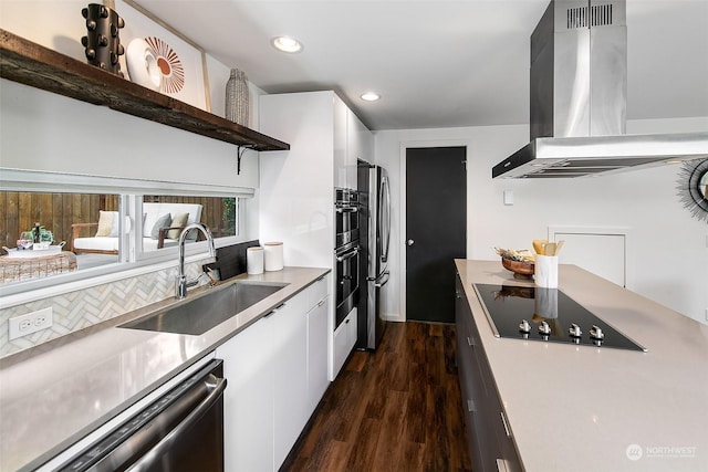 kitchen with white cabinets, sink, island range hood, and dishwashing machine