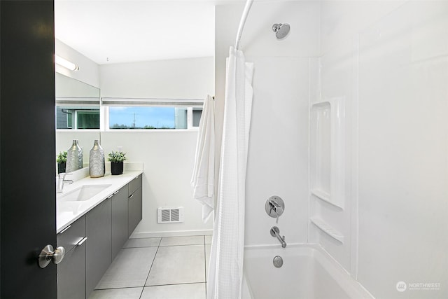 bathroom featuring tile patterned flooring, vanity, and shower / tub combo with curtain