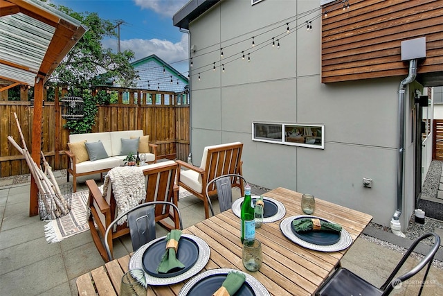 deck featuring an outdoor living space and a patio