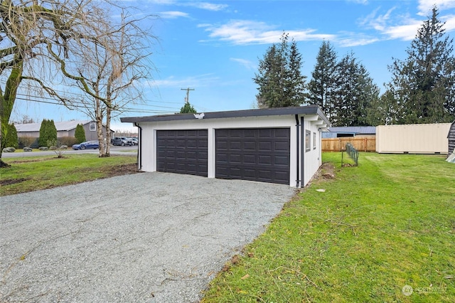 garage with a lawn