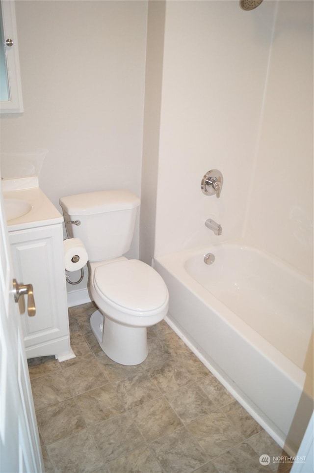 full bathroom with vanity, tub / shower combination, and toilet