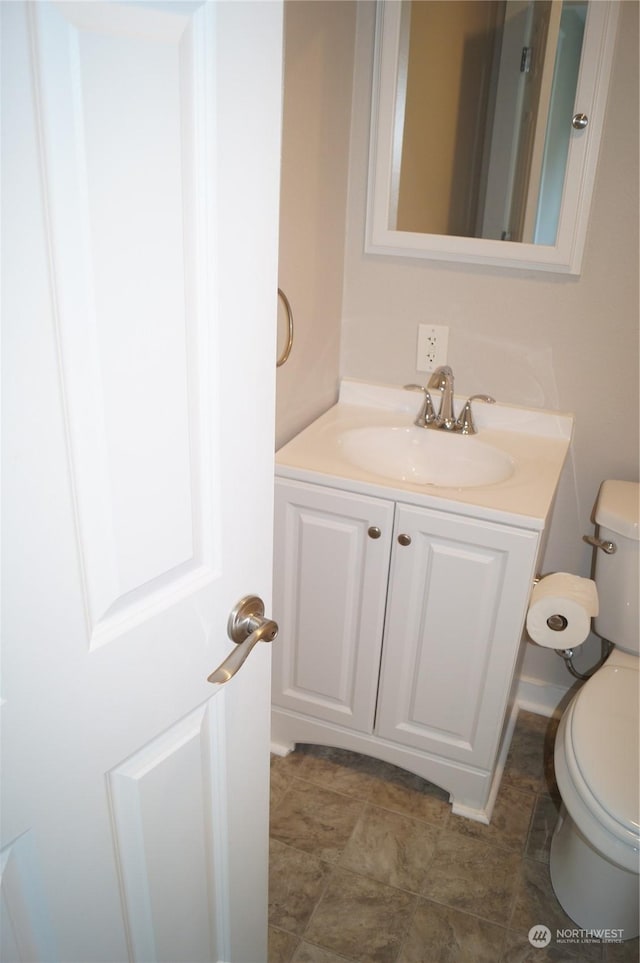 bathroom with vanity and toilet