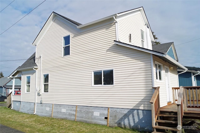 view of home's exterior with a yard