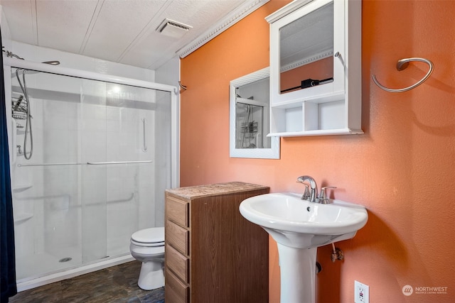 bathroom featuring toilet and walk in shower