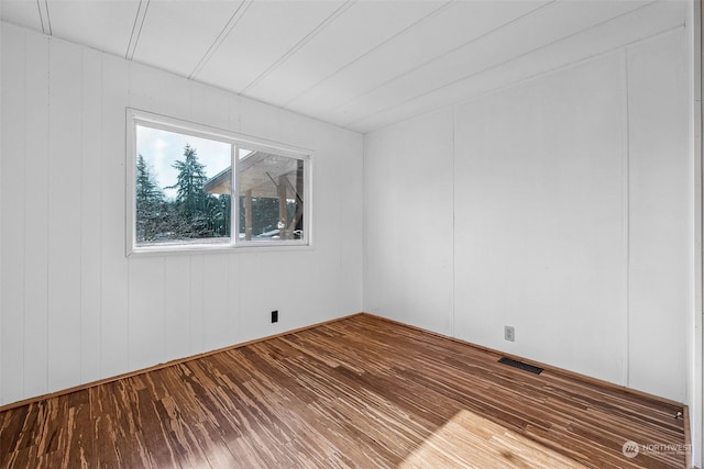 spare room featuring hardwood / wood-style floors