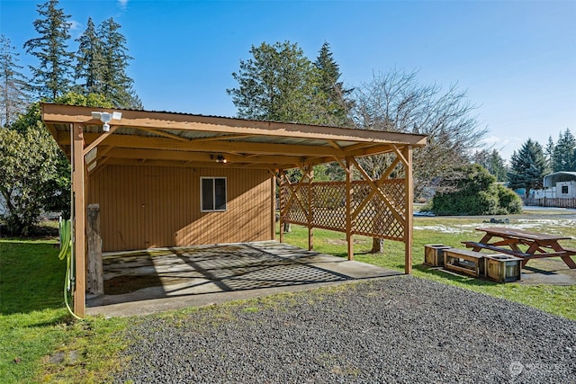 view of outbuilding featuring a lawn